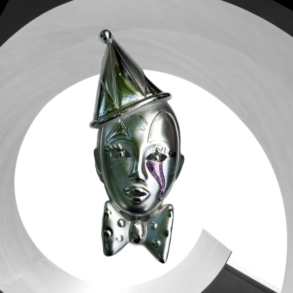 Vintage silver-tone Mime clown face brooch with a purple teardrop